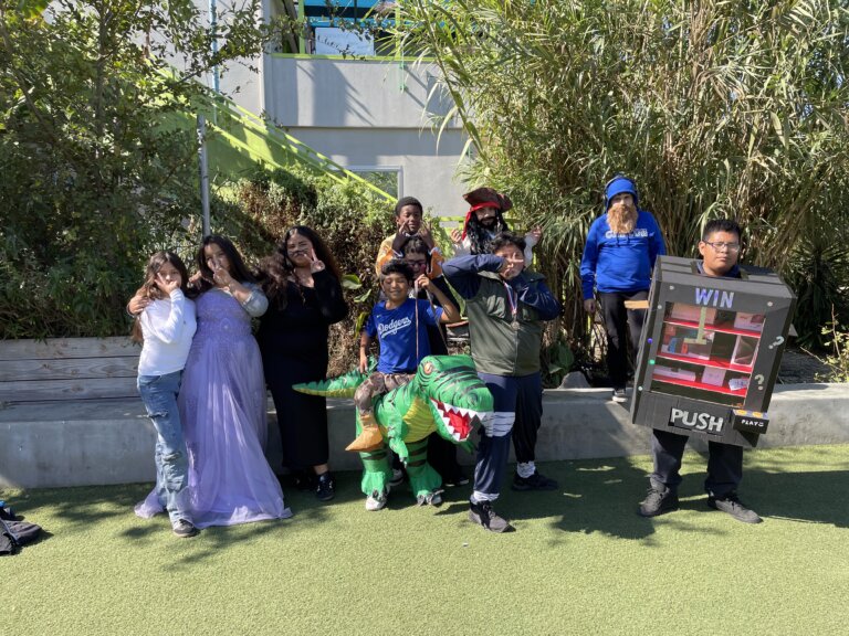 Students in costumes gathered on the campus lawn